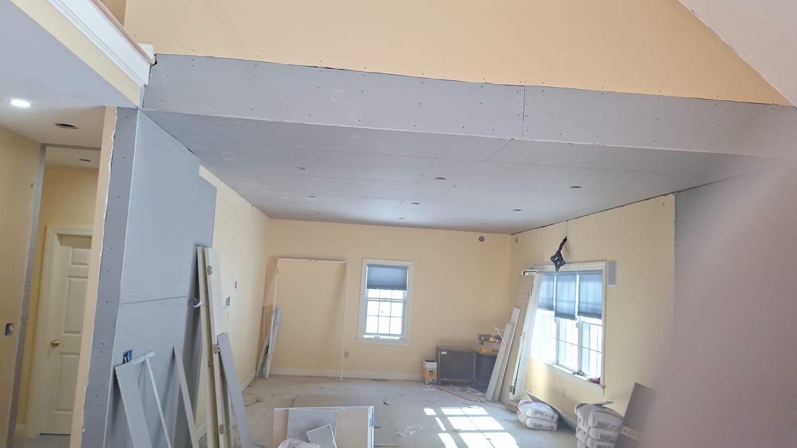 Smooth plaster finish on angled ceiling — close-up detail