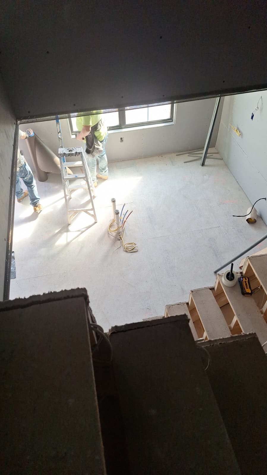 Emanuel Blueboard crew installing blueboard in new construction